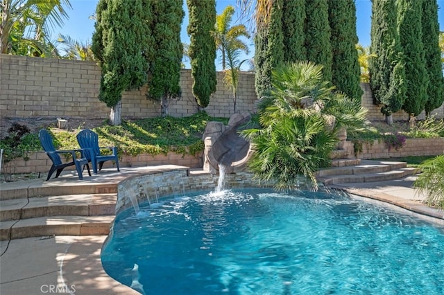 view of pool featuring a patio area, a fenced backyard, and a fenced in pool