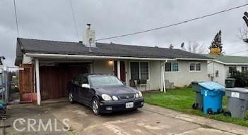 view of front of home featuring a garage and concrete driveway