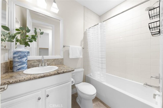 bathroom featuring shower / bath combo, vanity, and toilet