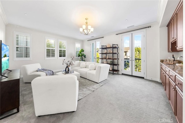 living area with a notable chandelier, light carpet, visible vents, ornamental molding, and french doors