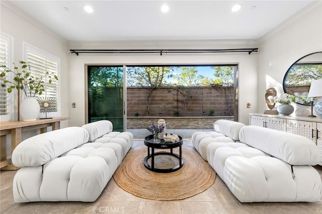 living area with recessed lighting, a wealth of natural light, and crown molding