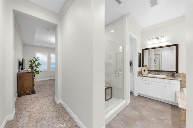 bathroom featuring a shower stall, visible vents, and crown molding