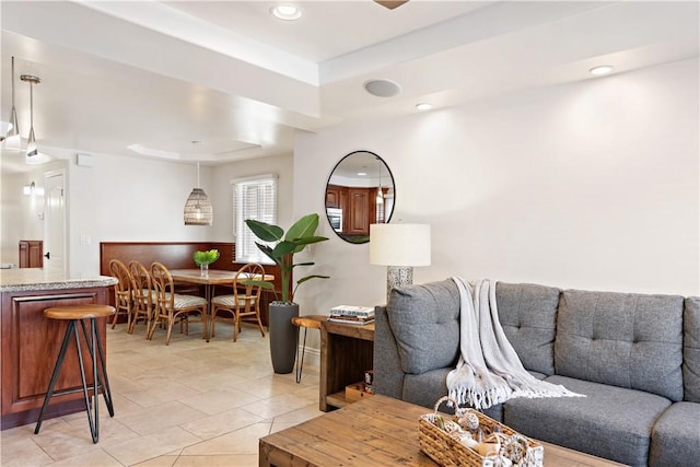 living area featuring light tile patterned floors and recessed lighting