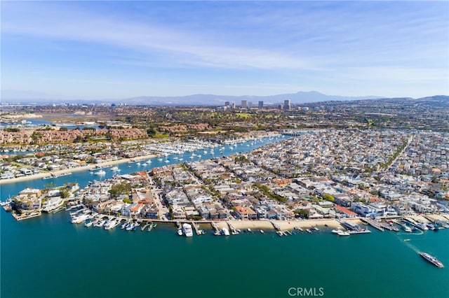 aerial view featuring a water and mountain view