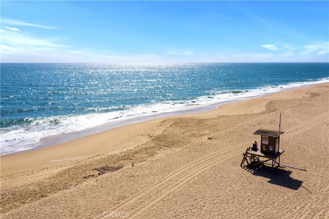 property view of water featuring a beach view