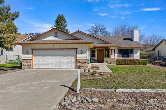 ranch-style home featuring a garage, driveway, stone siding, and fence