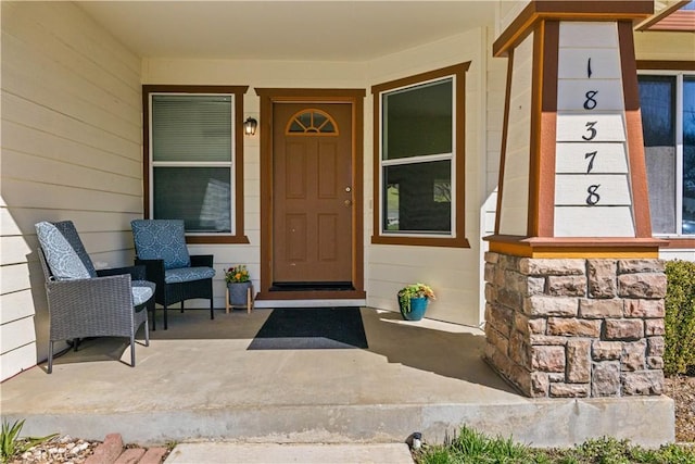 doorway to property featuring a porch