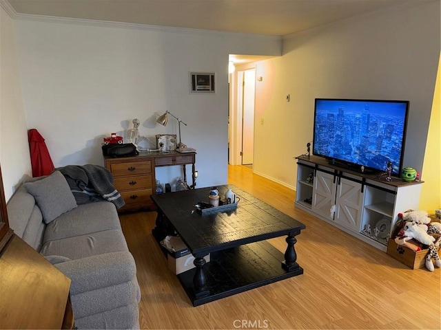 living area featuring crown molding and wood finished floors