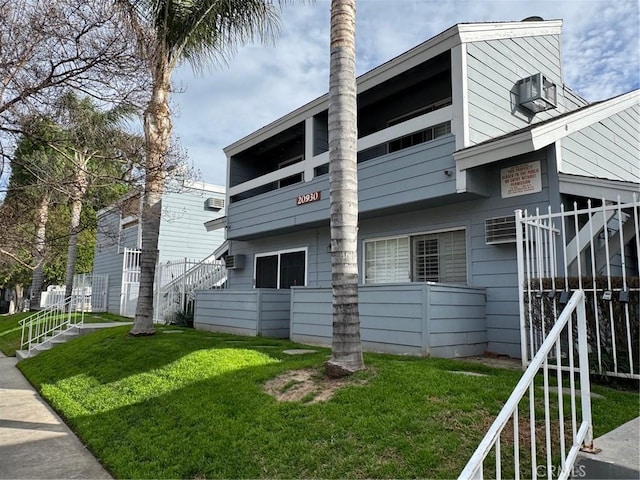 view of side of property with a lawn