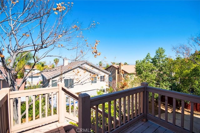 wooden terrace with a residential view