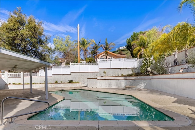 view of swimming pool featuring a patio, a fenced backyard, a fenced in pool, and ceiling fan