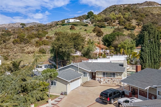 birds eye view of property featuring a mountain view