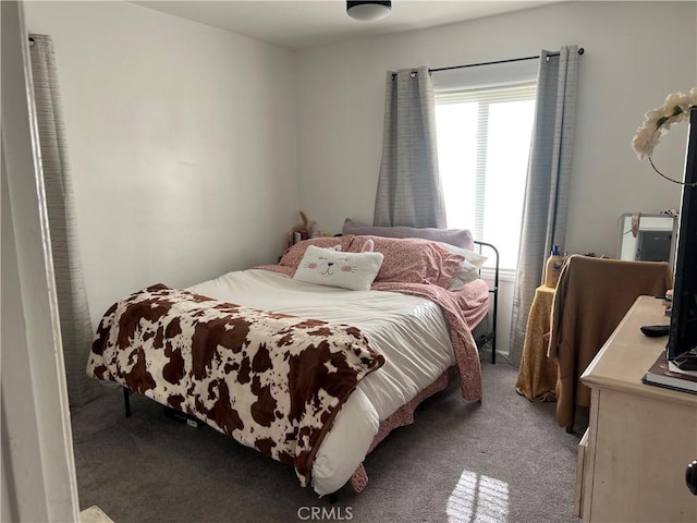 bedroom featuring light carpet