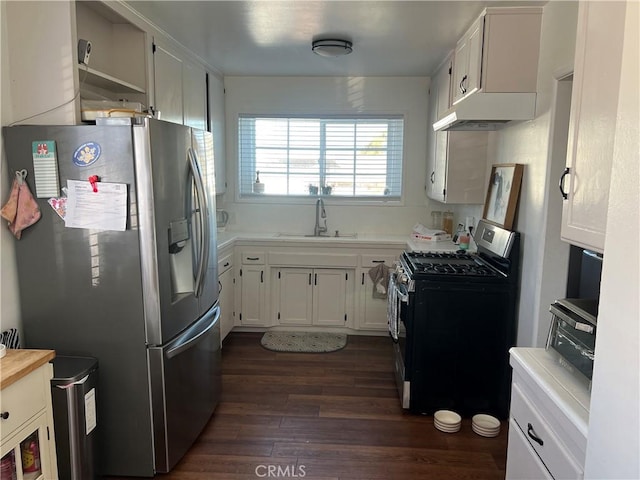 kitchen with stainless steel appliances, light countertops, a sink, and dark wood-style floors