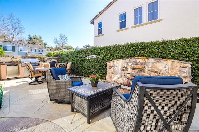 view of patio featuring area for grilling and an outdoor kitchen