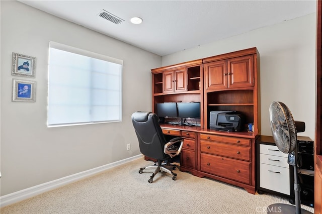 home office featuring visible vents, light colored carpet, and baseboards