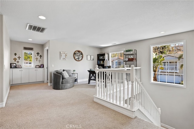 interior space with recessed lighting, visible vents, and baseboards