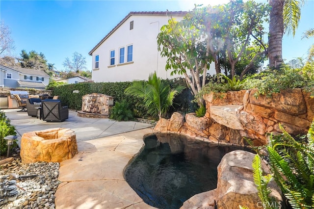 exterior space featuring a patio and fence