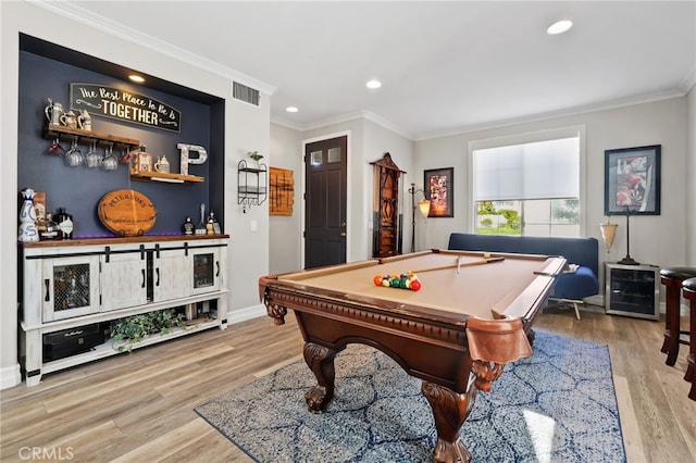 game room featuring crown molding, light wood-style flooring, billiards, and visible vents