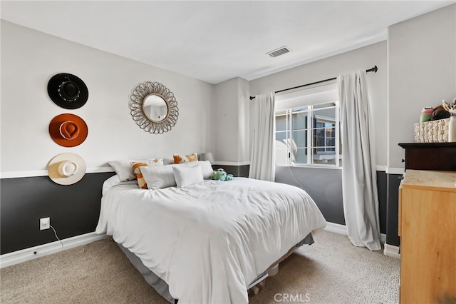 bedroom with visible vents, baseboards, and carpet flooring