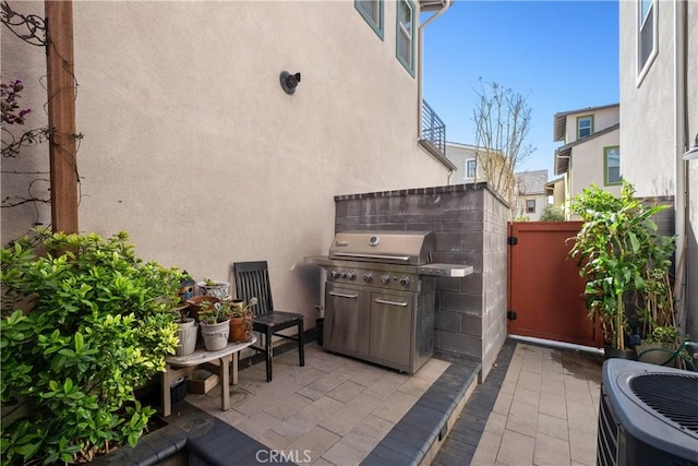 view of patio / terrace with a grill and central AC unit