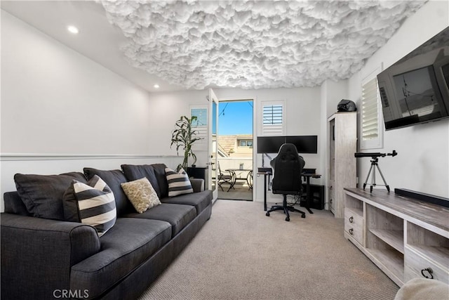 living area featuring carpet flooring and recessed lighting