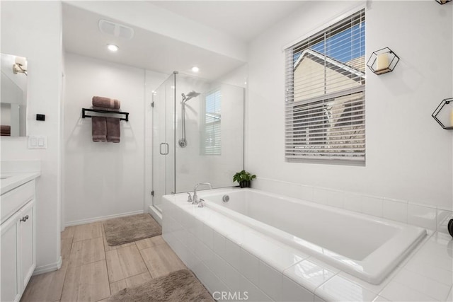166 Natal Rd, Rancho Mission Viejo, CA 92694 - bathroom featuring vanity, a garden tub, a shower stall, wood finished floors, and recessed lighting
