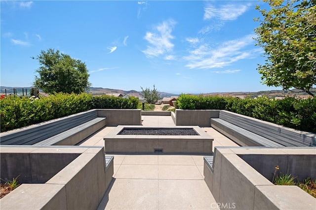 view of patio with an outdoor fire pit