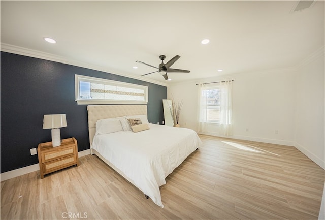 bedroom featuring ornamental molding, visible vents, and light wood-style floors