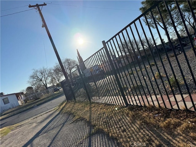 view of gate with fence