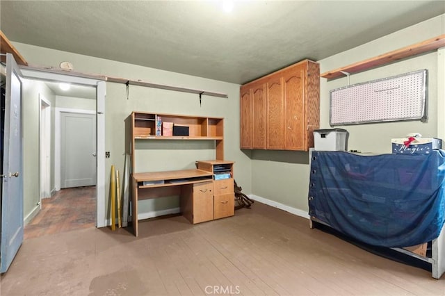 interior space with light wood-style floors and baseboards