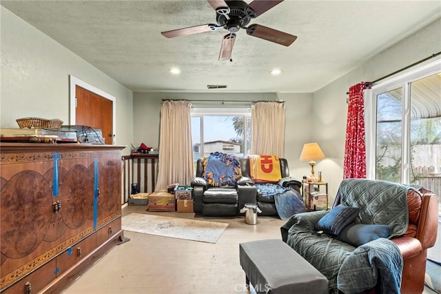 sitting room with recessed lighting, wood finished floors, visible vents, and a ceiling fan