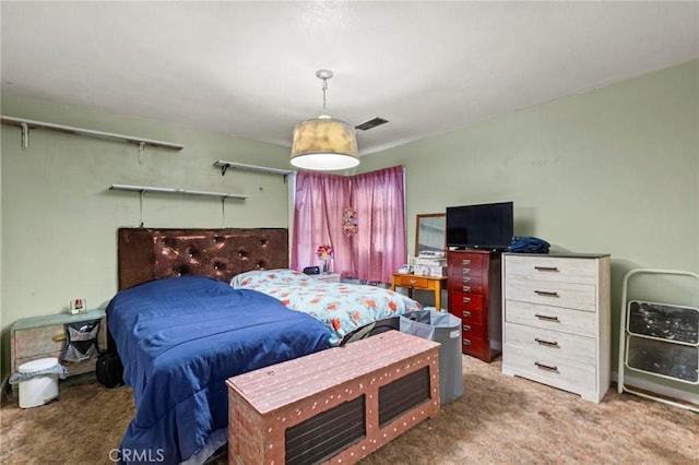 bedroom featuring carpet floors and visible vents