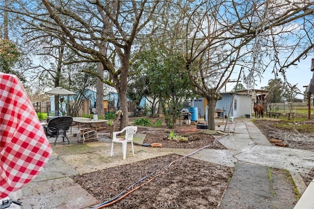 view of yard featuring a patio area and fence