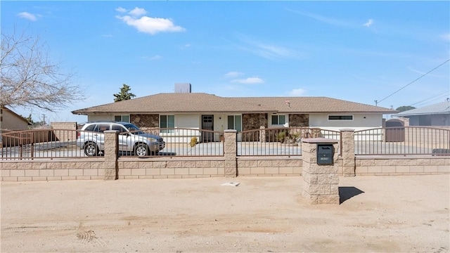 single story home featuring a gate and a fenced front yard