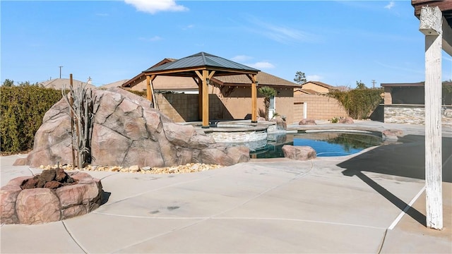 view of pool featuring a patio, a fenced backyard, a gazebo, a fenced in pool, and an in ground hot tub