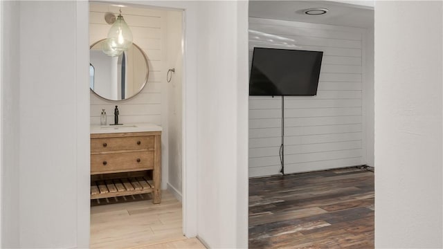 bathroom with vanity and wood finished floors