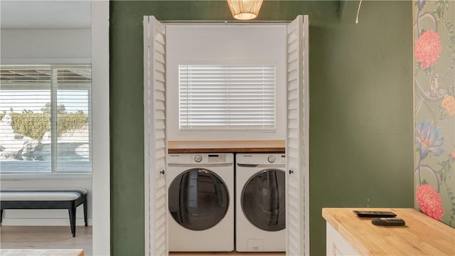 washroom with laundry area and separate washer and dryer