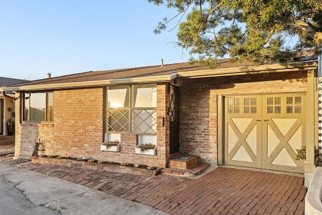 exterior space with brick siding