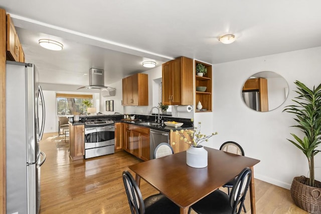 kitchen with stainless steel appliances, a sink, range hood, brown cabinets, and dark countertops