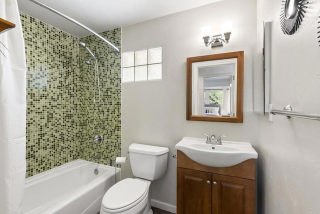 full bathroom featuring toilet, shower / tub combo, and vanity