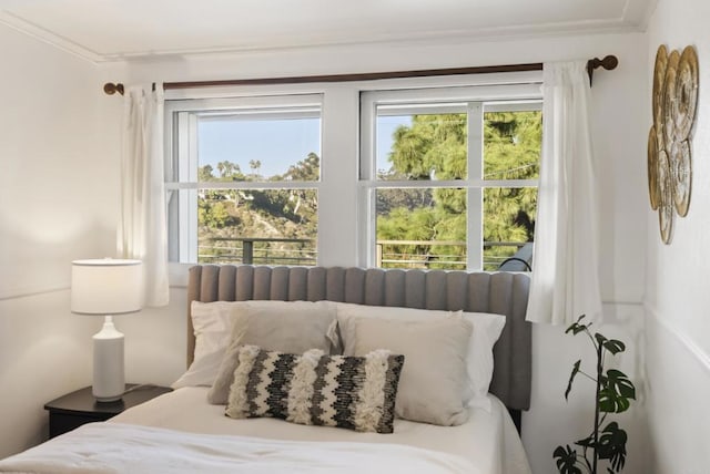 bedroom featuring crown molding