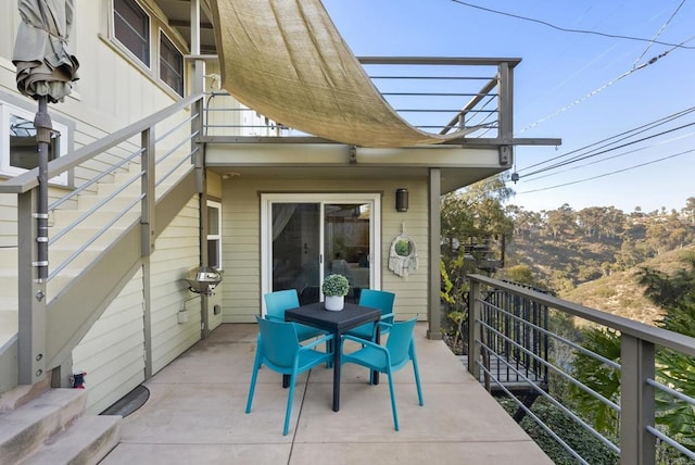 balcony featuring outdoor dining area