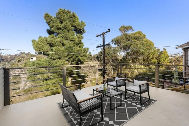 view of patio featuring a balcony