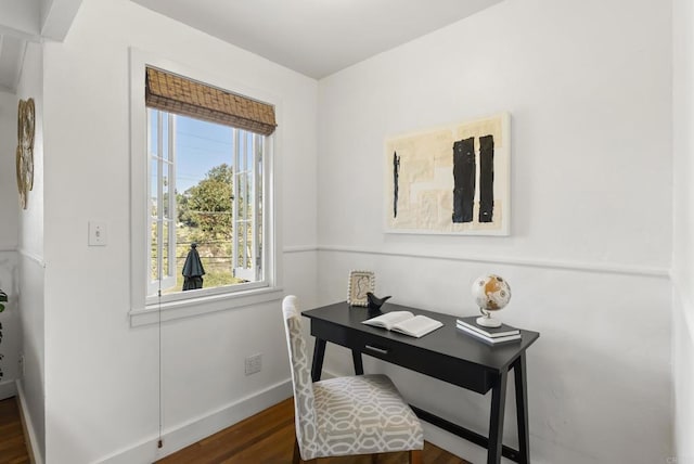 office area with baseboards and wood finished floors