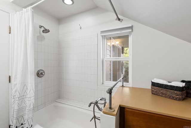 full bath featuring lofted ceiling and shower / bath combo with shower curtain