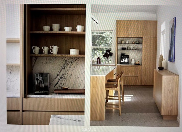 bar with wallpapered walls and built in features