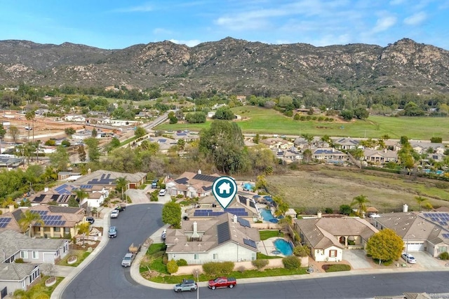 birds eye view of property with a mountain view and a residential view