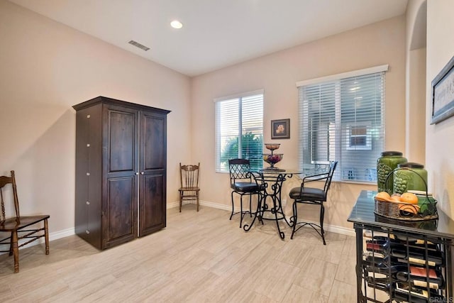 dining area with recessed lighting, light wood finished floors, visible vents, and baseboards
