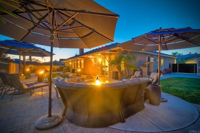view of patio / terrace featuring an outdoor fire pit